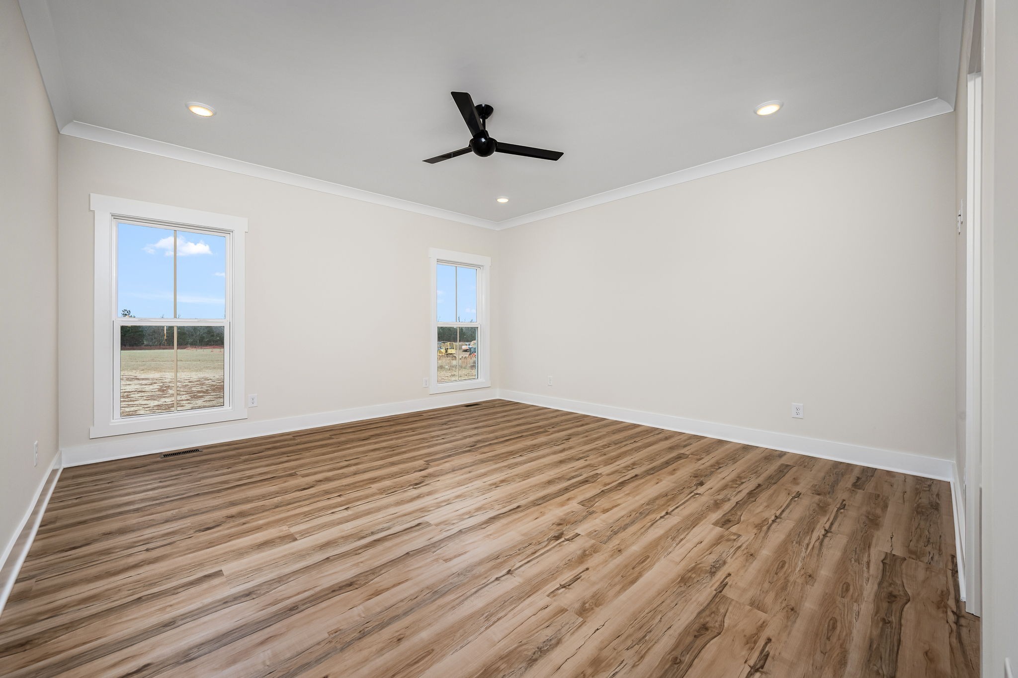 7302 West Gum Road Murfreesboro, TN 37127 - Photo 27 of 53 a view of empty room with wooden floor and fan