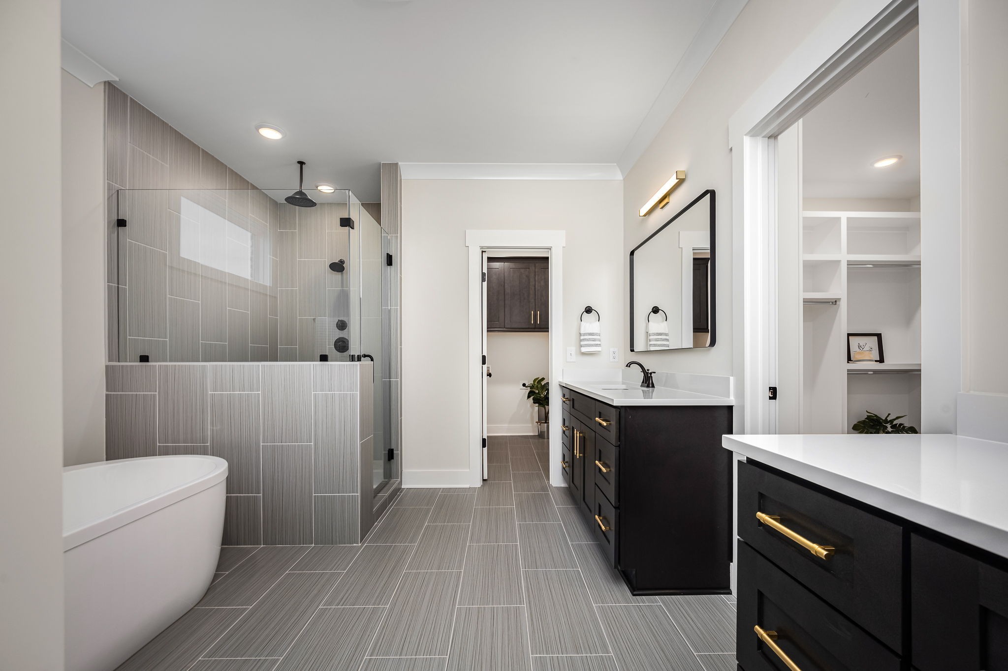 7302 West Gum Road Murfreesboro, TN 37127 - Photo 30 of 53 a large bathroom with a double vanity sink toilet mirror and bathtub