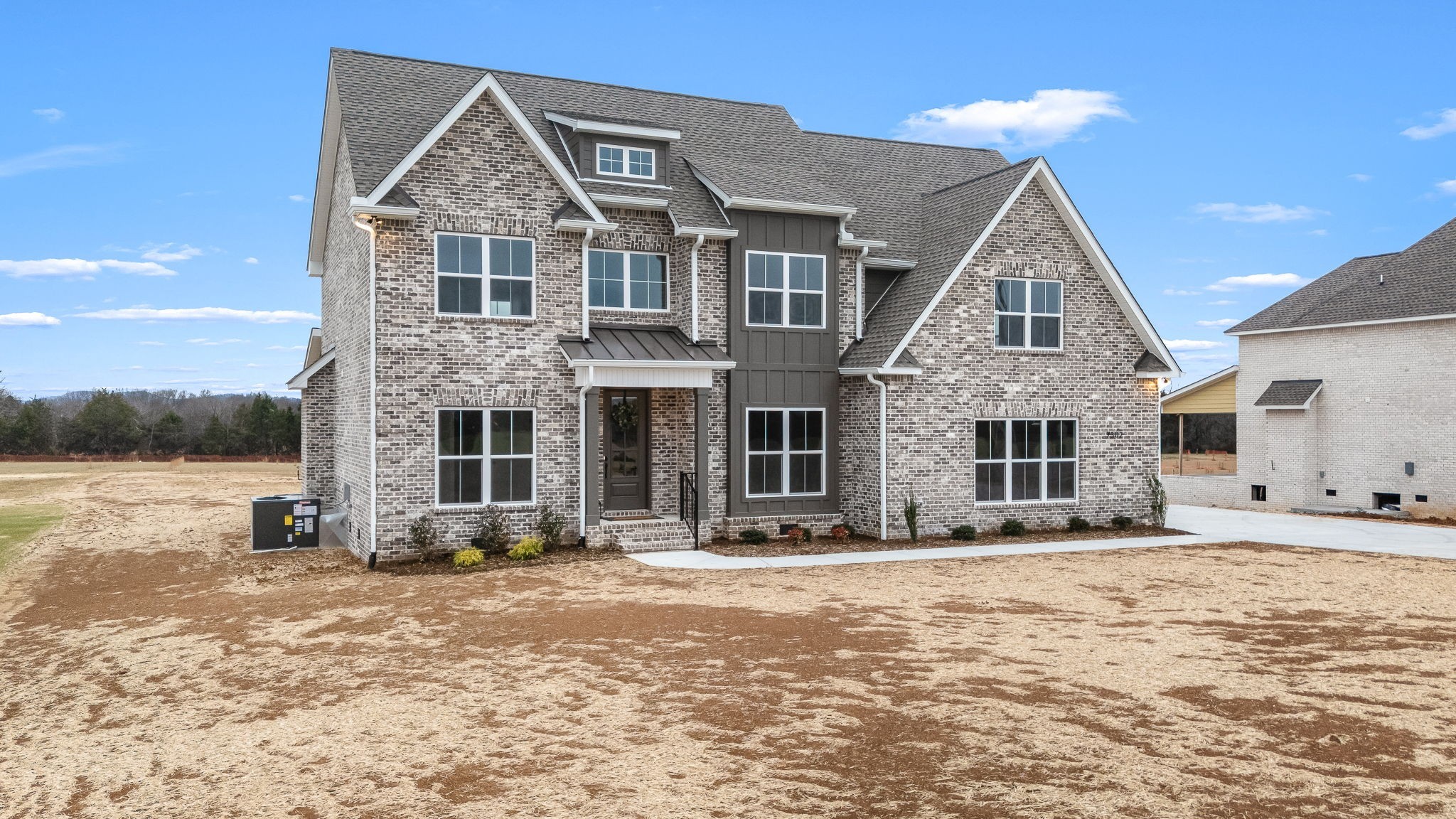 7302 West Gum Road Murfreesboro, TN 37127 - Photo 3 of 53 a front view of a house with a yard