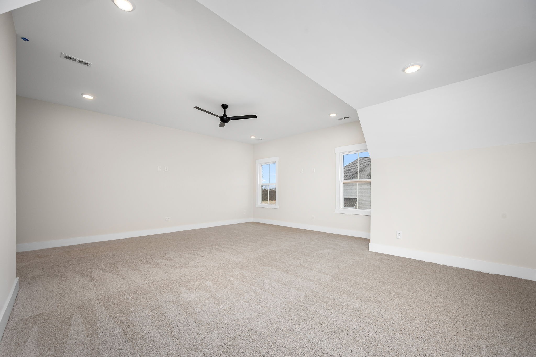 7302 West Gum Road Murfreesboro, TN 37127 - Photo 42 of 53 an empty room with a ceiling fan and window