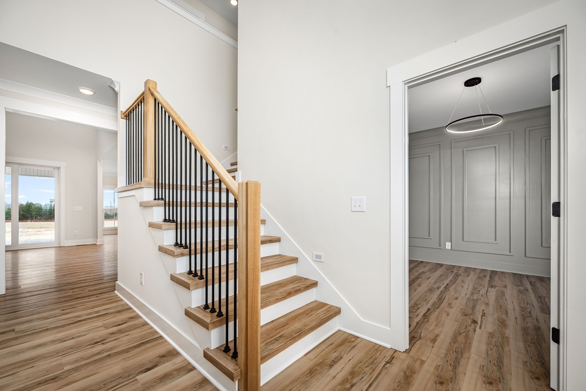 7302 West Gum Road Murfreesboro, TN 37127 - Photo 7 of 53 a view of a hallway with wooden floor and staircase