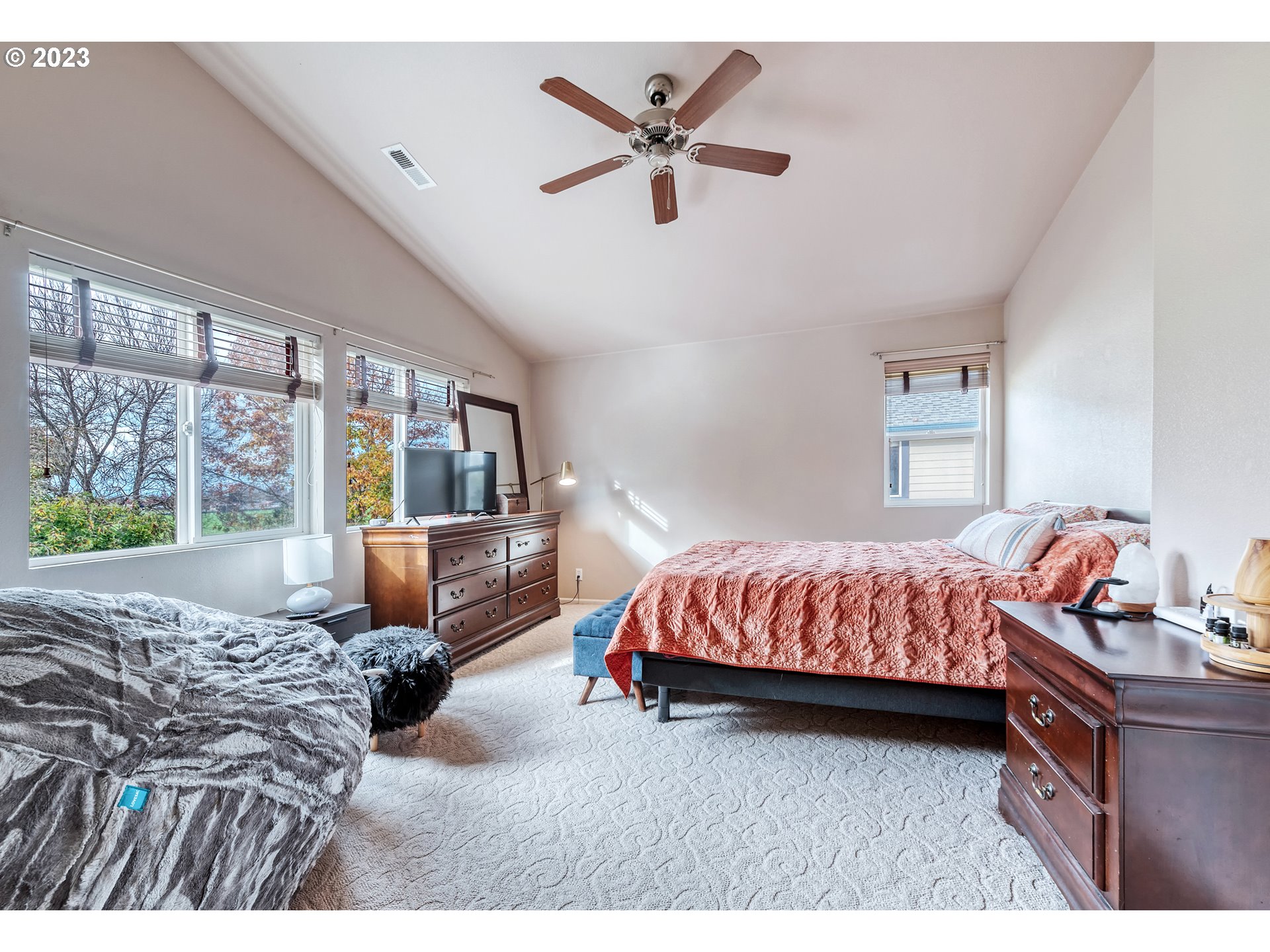 5588 Wales Drive Eugene, OR 97402 - Photo 24 of 41 a bedroom with a bed and a large window