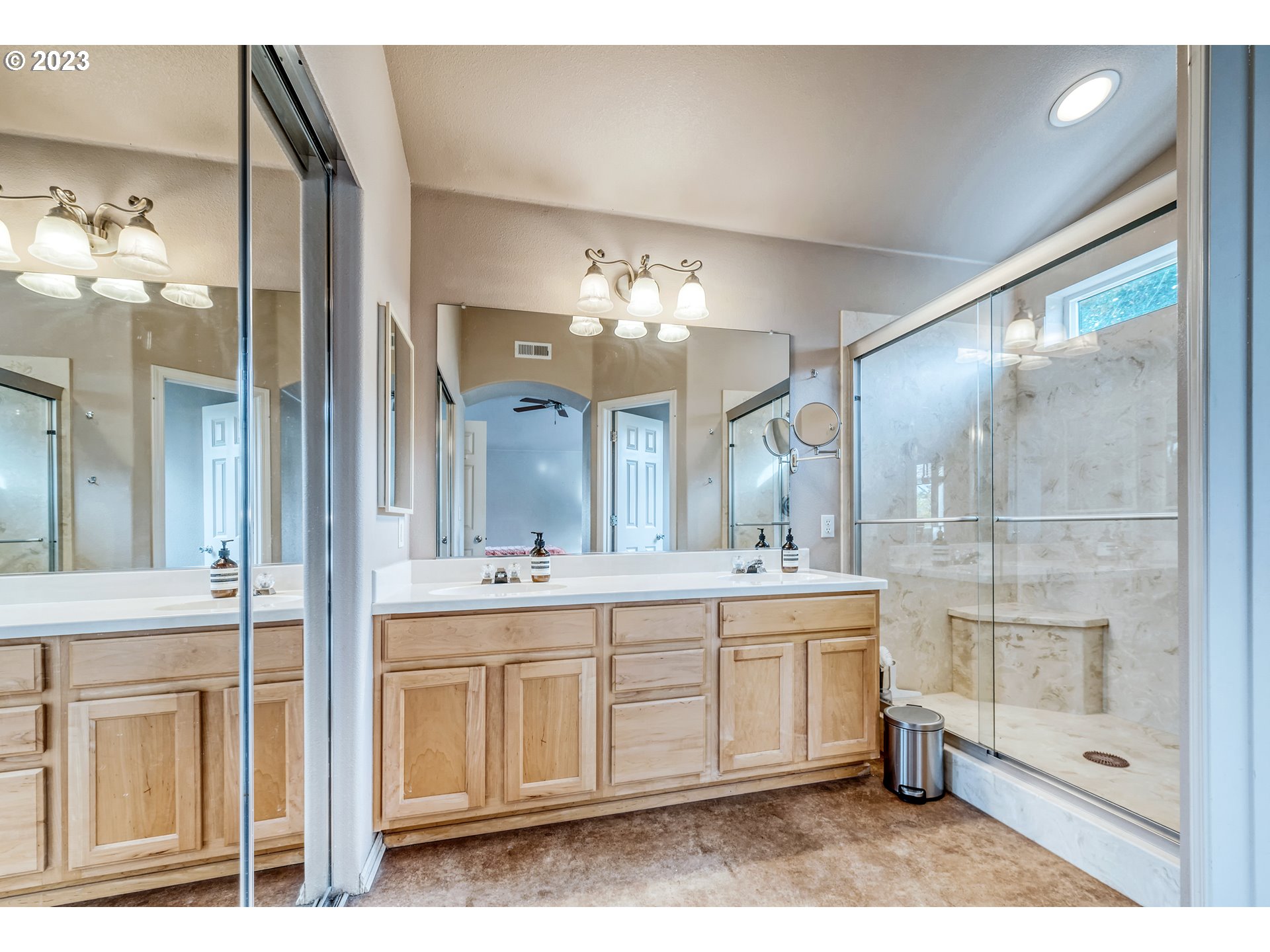5588 Wales Drive Eugene, OR 97402 - Photo 27 of 41 a spacious bathroom with a sink and a mirror with bathtub