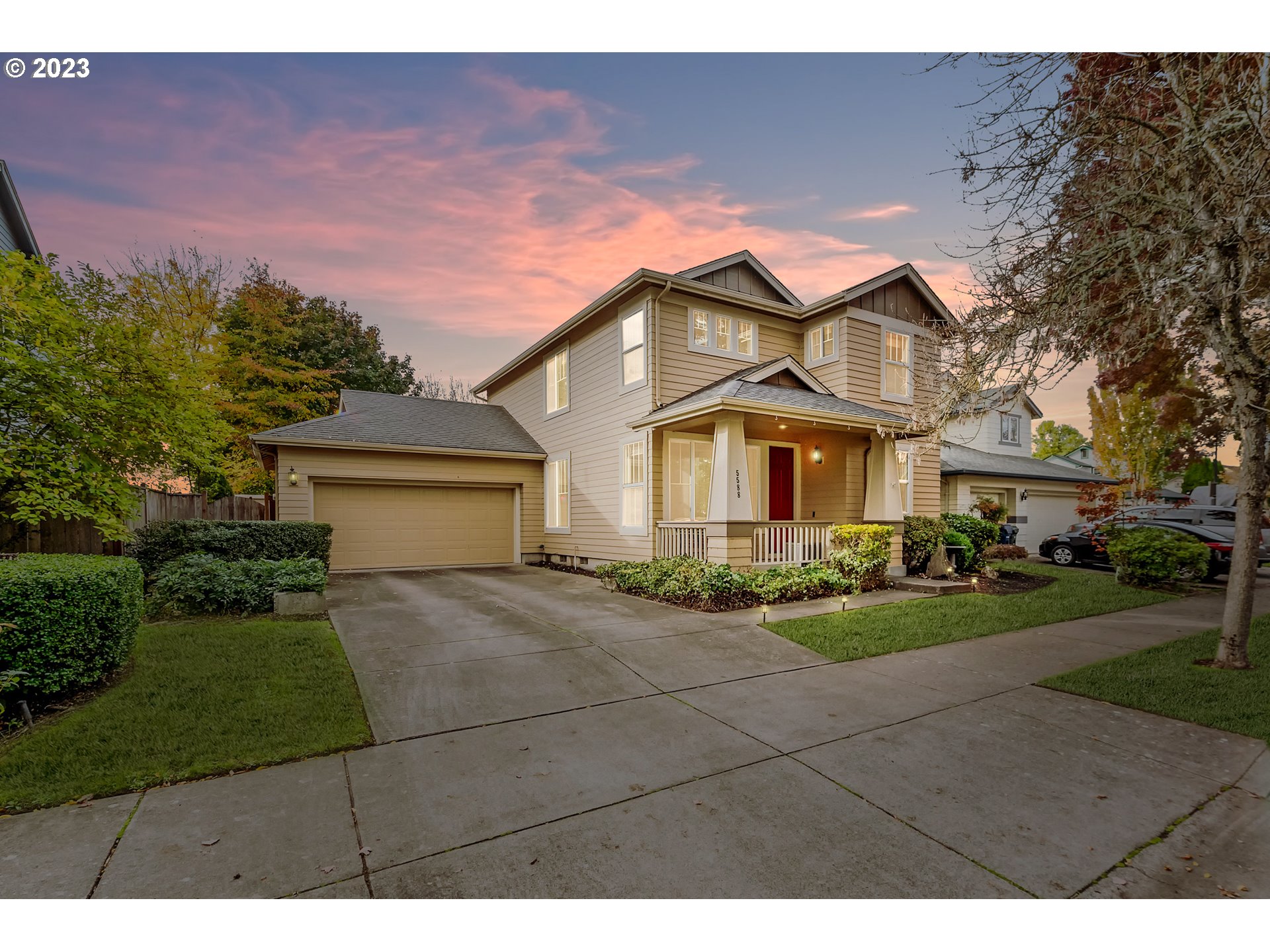 5588 Wales Drive Eugene, OR 97402 - Photo 3 of 41 a front view of a house with a yard and garage