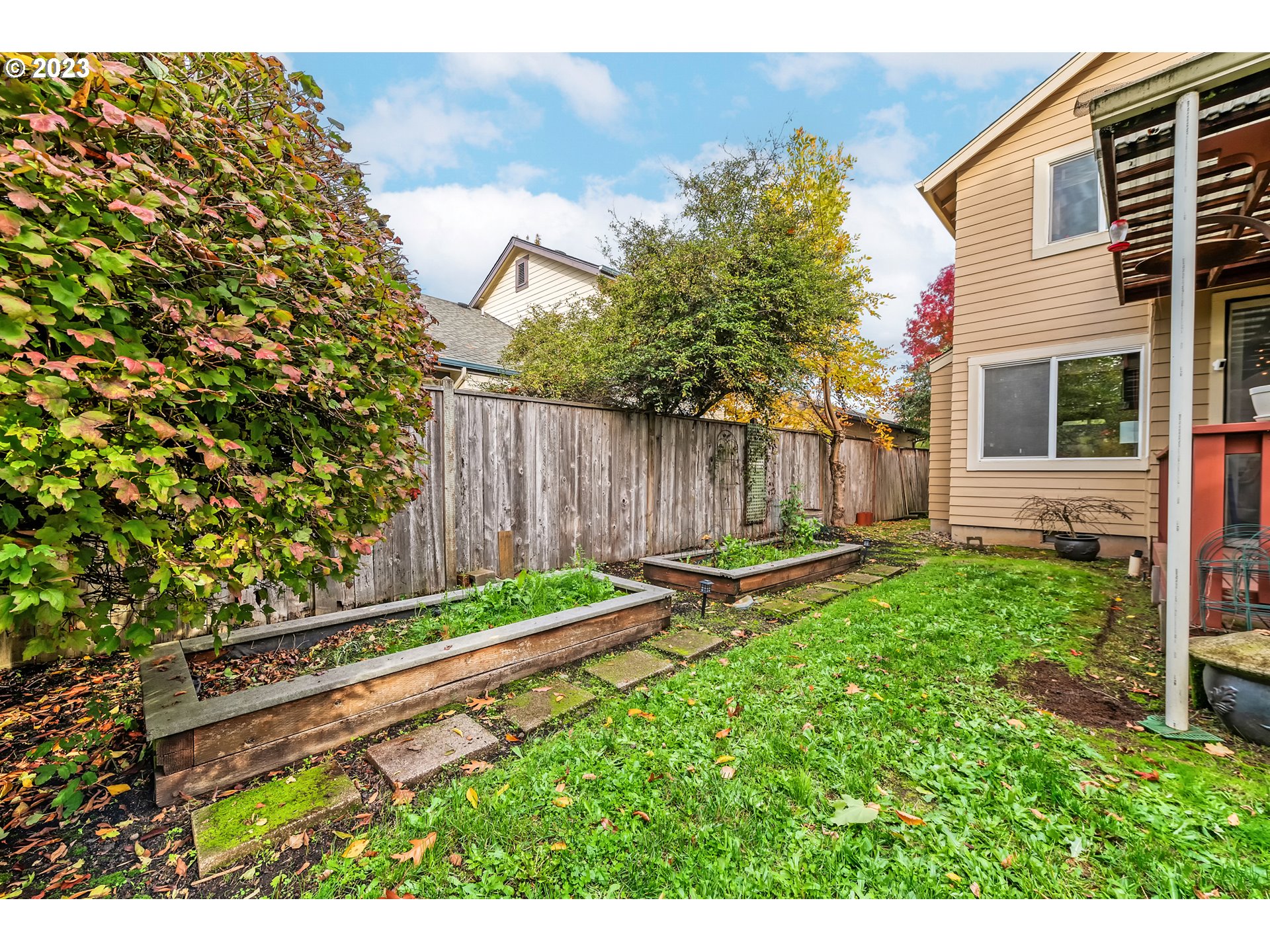 5588 Wales Drive Eugene, OR 97402 - Photo 36 of 41 a backyard of a house with table and chairs
