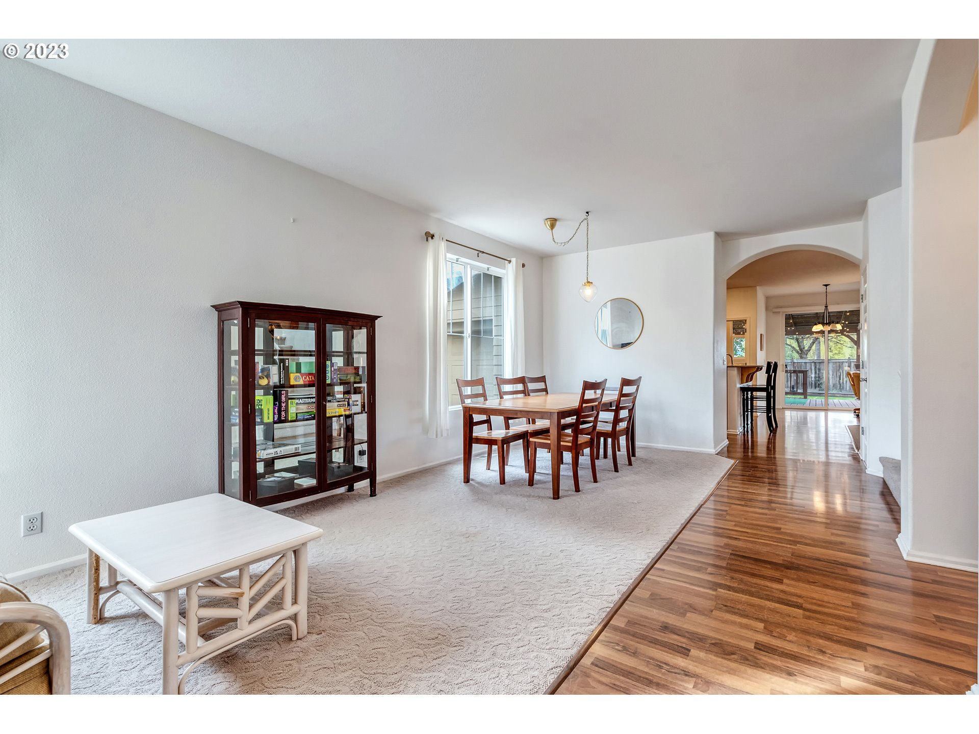5588 Wales Drive Eugene, OR 97402 - Photo 6 of 41 a living room with furniture a dining table and chairs with wooden floor