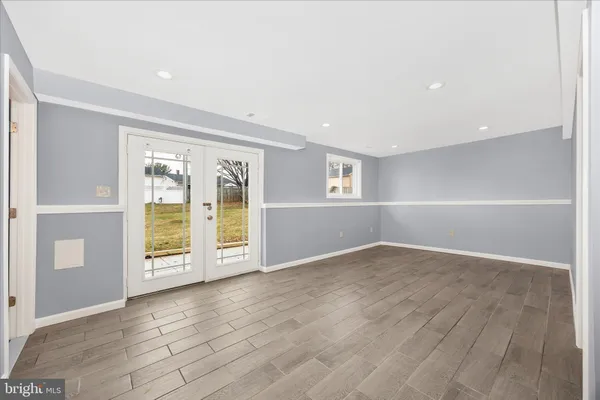 a room that has a bed and a window in it