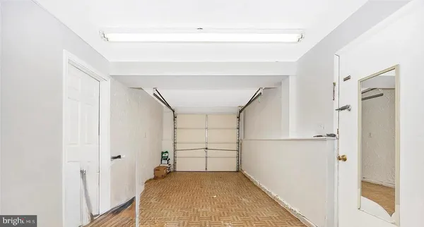 a view of a house with a wooden fence