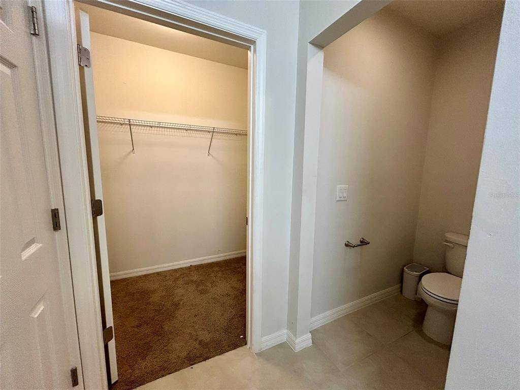 5270 Shell Mound Circle Punta Gorda, FL 33982 - Photo 13 of 23 a bathroom with a granite countertop toilet and a shower