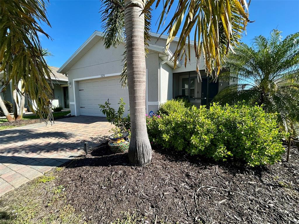5270 Shell Mound Circle Punta Gorda, FL 33982 - Photo 2 of 23 a front view of a house with a yard