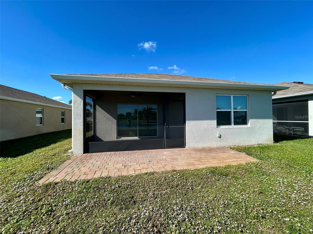 5270 Shell Mound Circle Punta Gorda, FL 33982 - Photo 21 of 23 a front view of a house with a yard