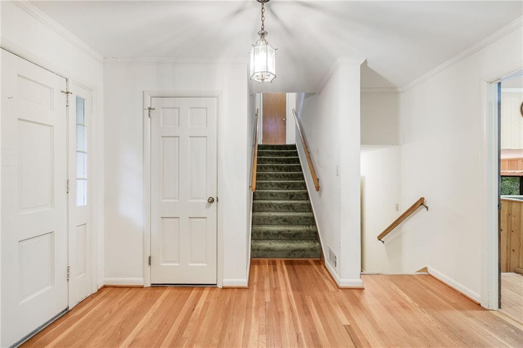 1911 Alderbrook Road Northeast Atlanta, GA 30345 - Photo 6 of 33 a view of a room with wooden floor and stairs
