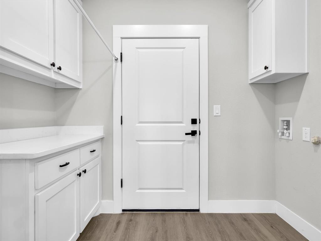 4905 Sweetbay Road Sherman, TX 75092 - Photo 23 of 26 a view of walk in closet with white wooden cabinets