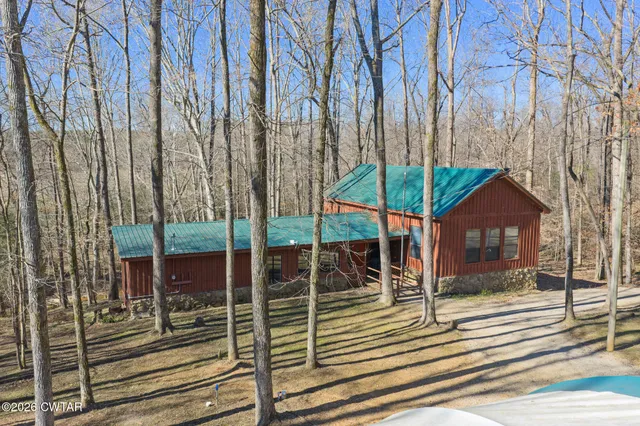 a view of a chair and tables in the backyard