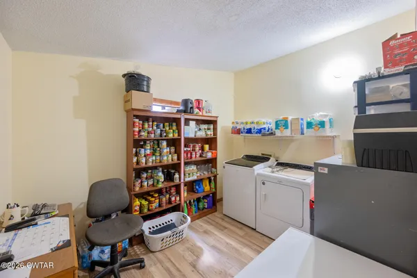 a room with furniture a washer and dryer