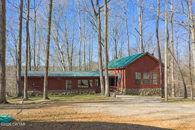 a front view of a residential apartment building with a yard