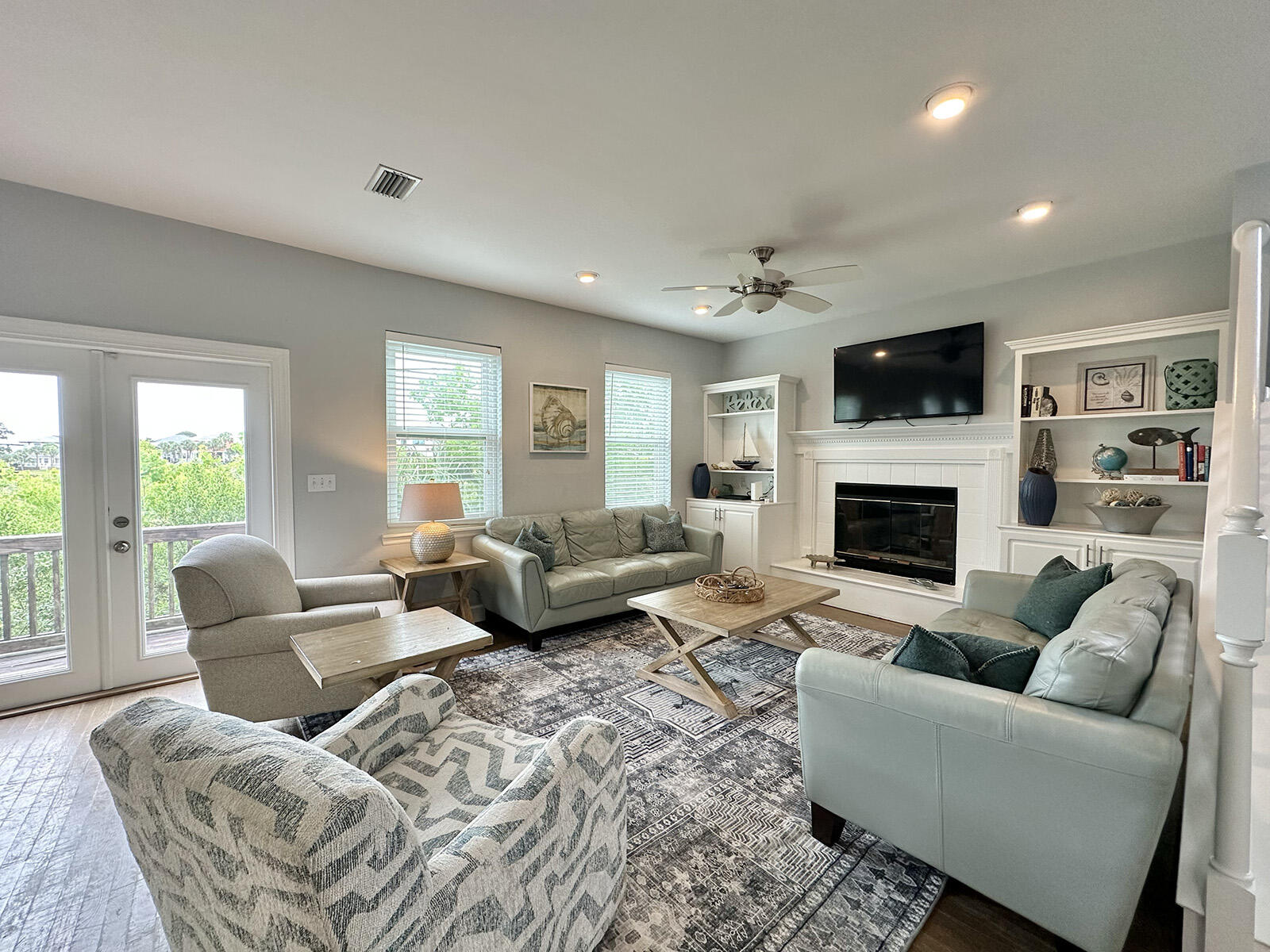 83 Sunfish Street Destin, FL 32541 - Photo 16 of 56 a living room with furniture fireplace and a flat screen tv