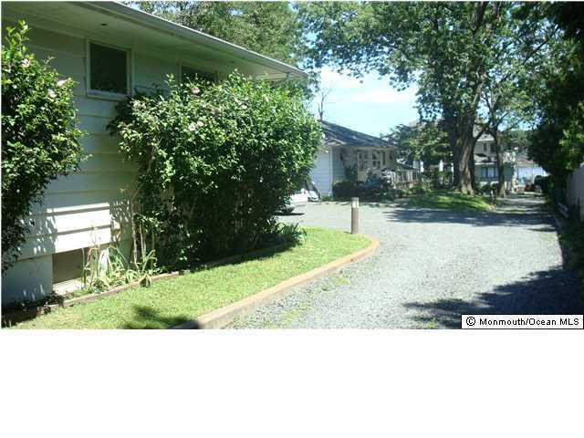 3721 River Road, Unit AD Point Pleasant, NJ 08742 - Photo 5 of 10 a black and white photo of a house