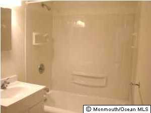 3721 River Road, Unit AD Point Pleasant, NJ 08742 - Photo 10 of 10 a bathroom with a bathtub and shower