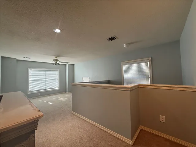 a view of empty room with windows