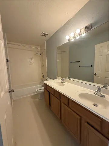 a view of staircase with white walls and a window
