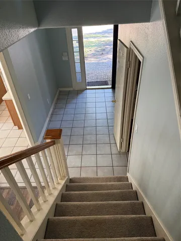 a view of an empty room and closet area