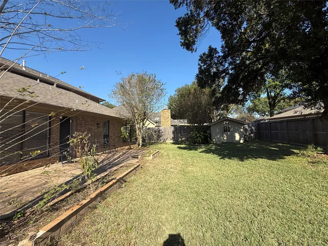a view of a house with a snow in the background