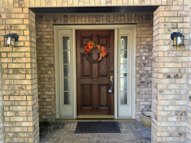 a view of a entryway door front of a house