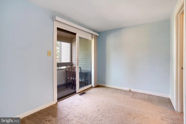 a living room with furniture and stairs