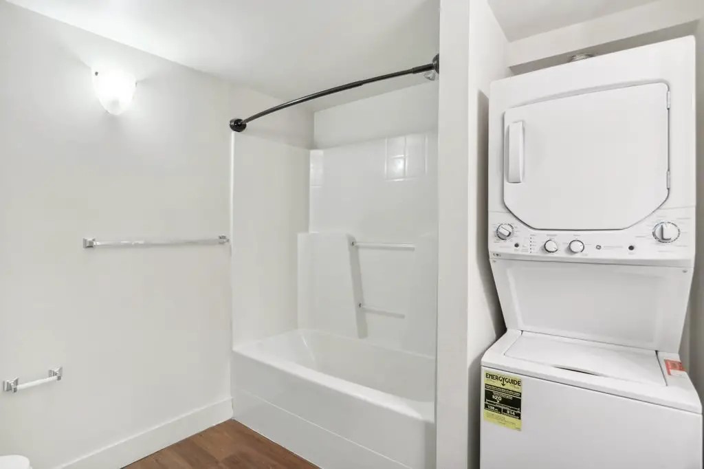 201 Yesler Way Seattle, WA 98104 - Photo 20 of 21 a bathroom with a bathtub a toilet and a shower