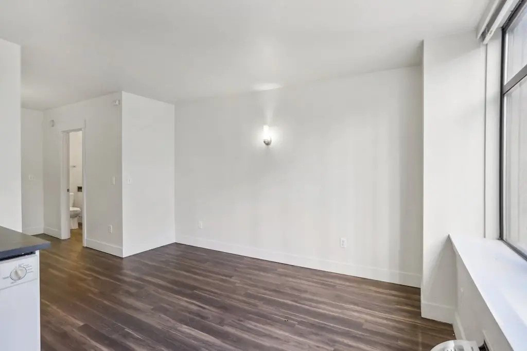 201 Yesler Way Seattle, WA 98104 - Photo 21 of 21 a view of a room with wooden floor