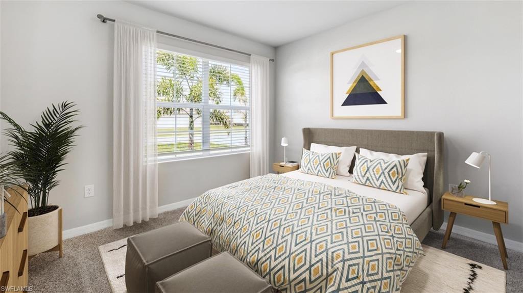 124 Nelson Road South Cape Coral, FL 33991 - Photo 5 of 10 a bedroom with a bed and a painting on the wall