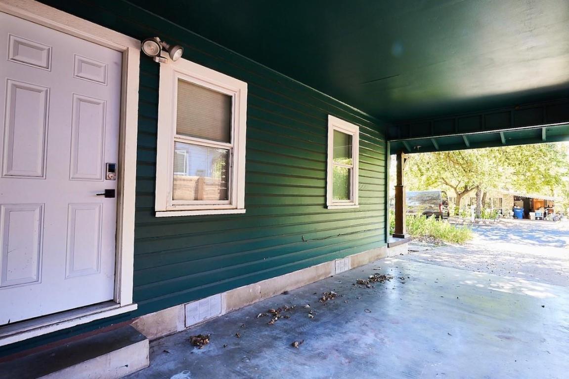 4704 Bandera Road Austin, TX 78721 - Photo 16 of 18 a view of a house with a yard