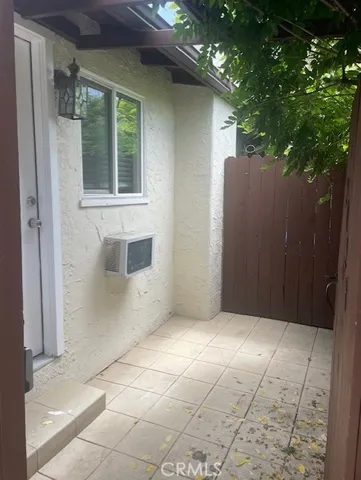 a view of an empty room and wooden floor