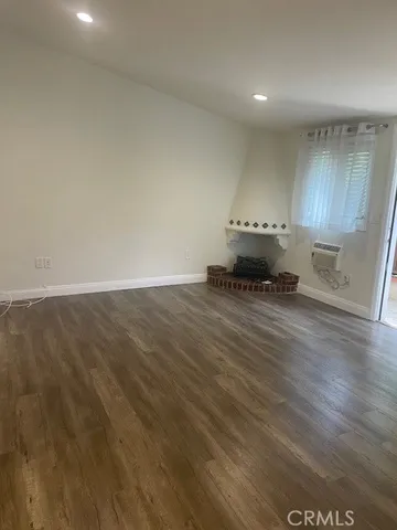 a bathroom with a granite countertop sink a toilet and a mirror