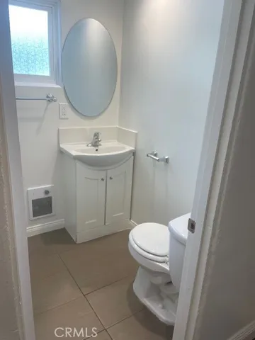 a kitchen with a refrigerator sink stove and cabinets
