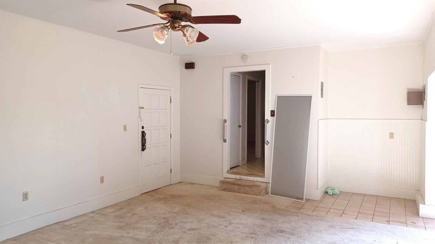 206 South W 7th Street Lockney, TX 79241 - Photo 19 of 47 an empty room with a door