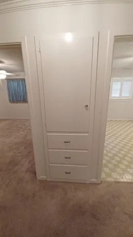 a bathroom with a sink a toilet and a window