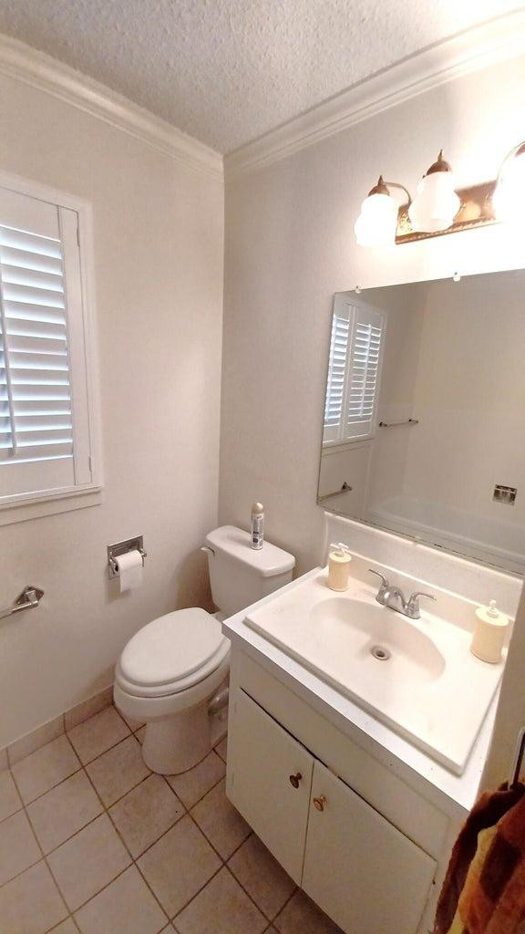 206 South W 7th Street Lockney, TX 79241 - Photo 28 of 47 a bathroom with a sink and a toilet