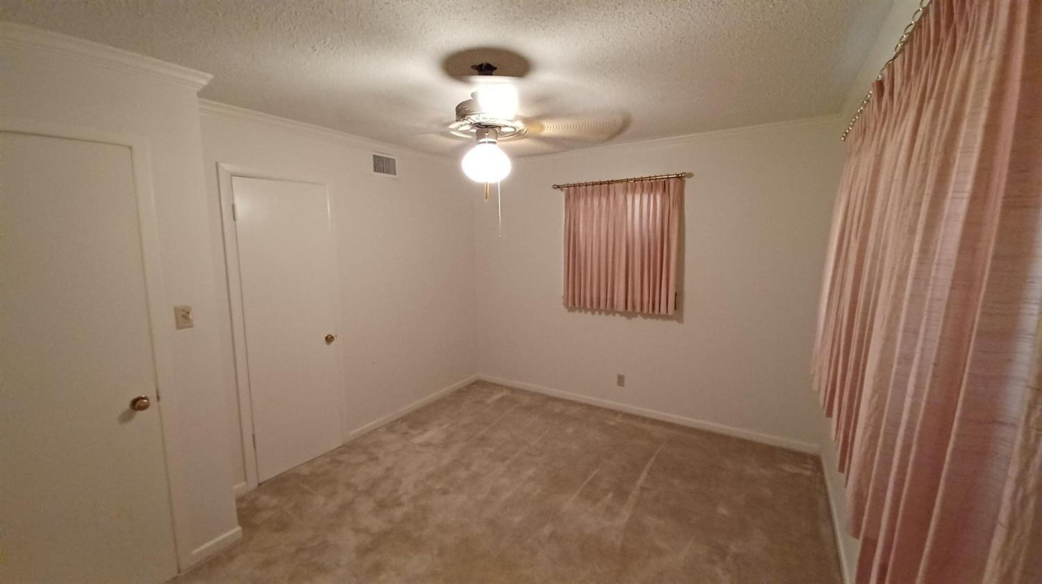 206 South W 7th Street Lockney, TX 79241 - Photo 36 of 47 a view of an empty room with a window
