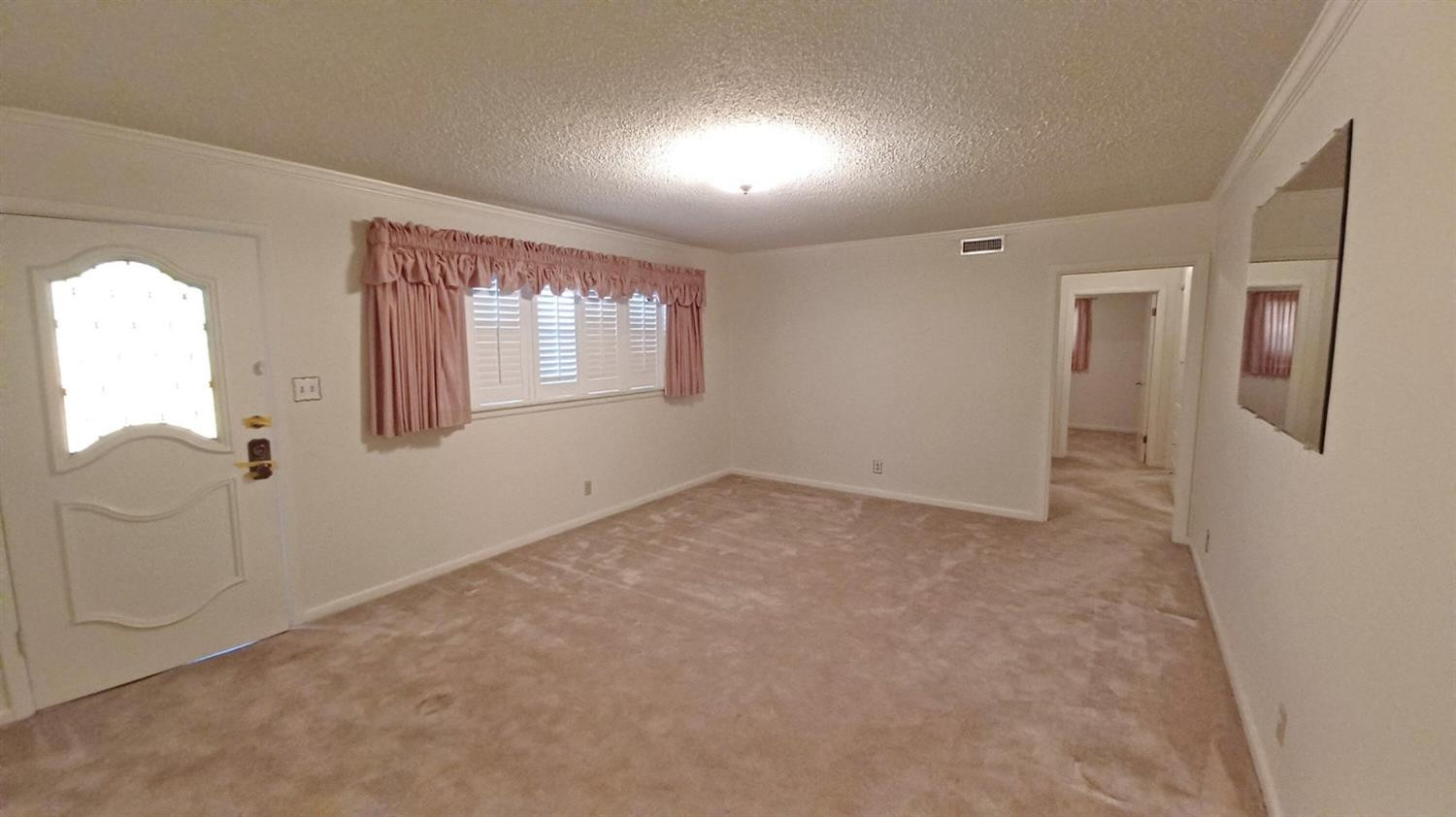 206 South W 7th Street Lockney, TX 79241 - Photo 5 of 47 an empty room with windows