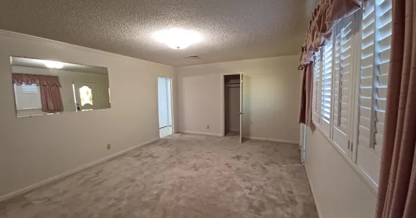 en empty room with windows