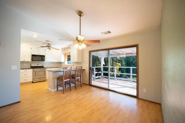 a view of room with window and refrigerator
