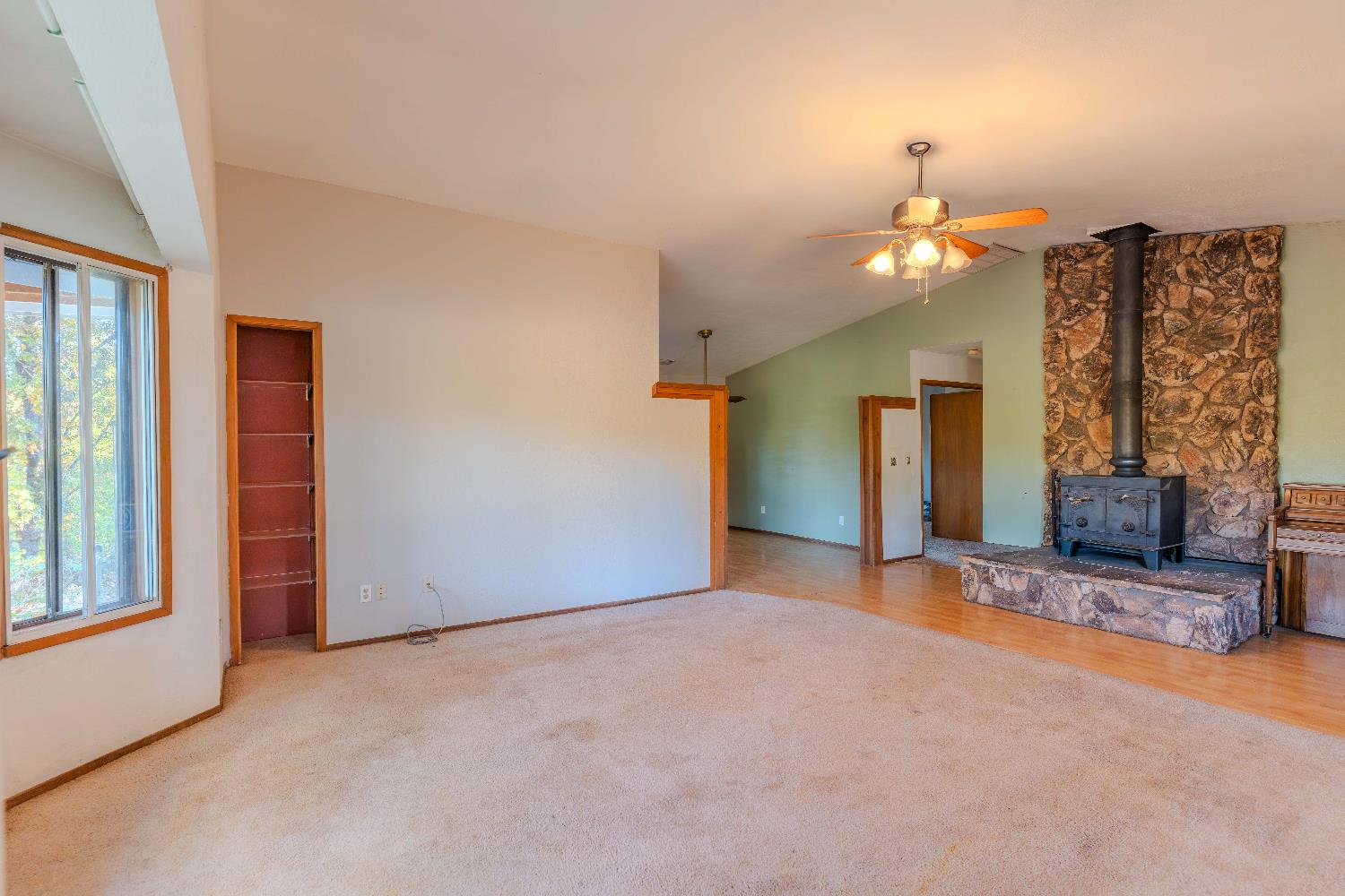 33 Stanley Road West Point, CA 95255 - Photo 9 of 46 an empty room with windows and fireplace