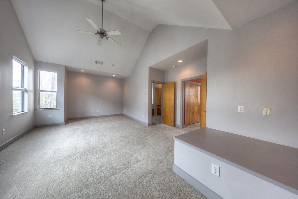 2310 Union Street, Unit A Houston, TX 77007 - Photo 13 of 16 an empty room with windows and ceiling fan