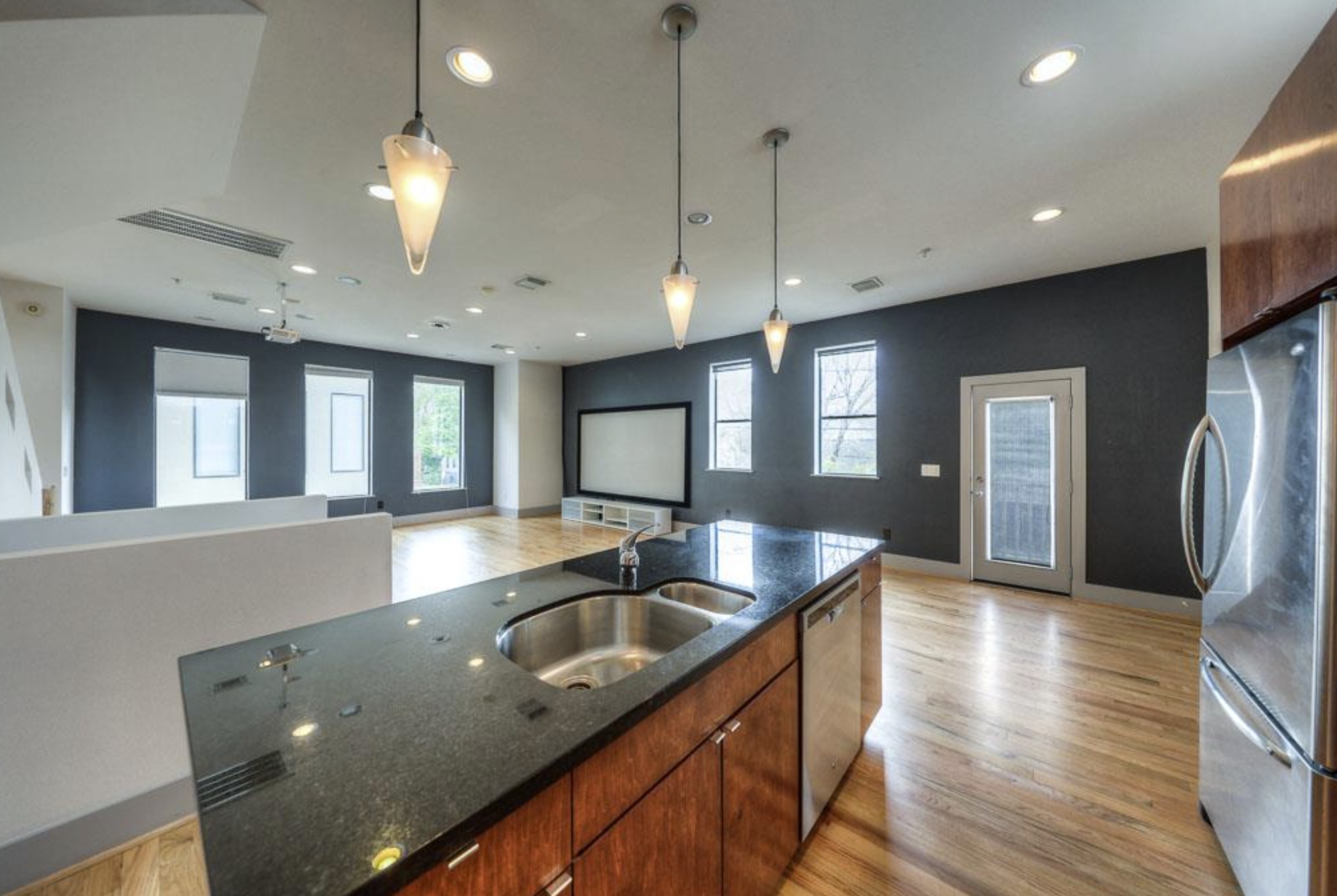 2310 Union Street, Unit A Houston, TX 77007 - Photo 7 of 16 a kitchen with stainless steel appliances granite countertop a sink a stove and a wooden floors