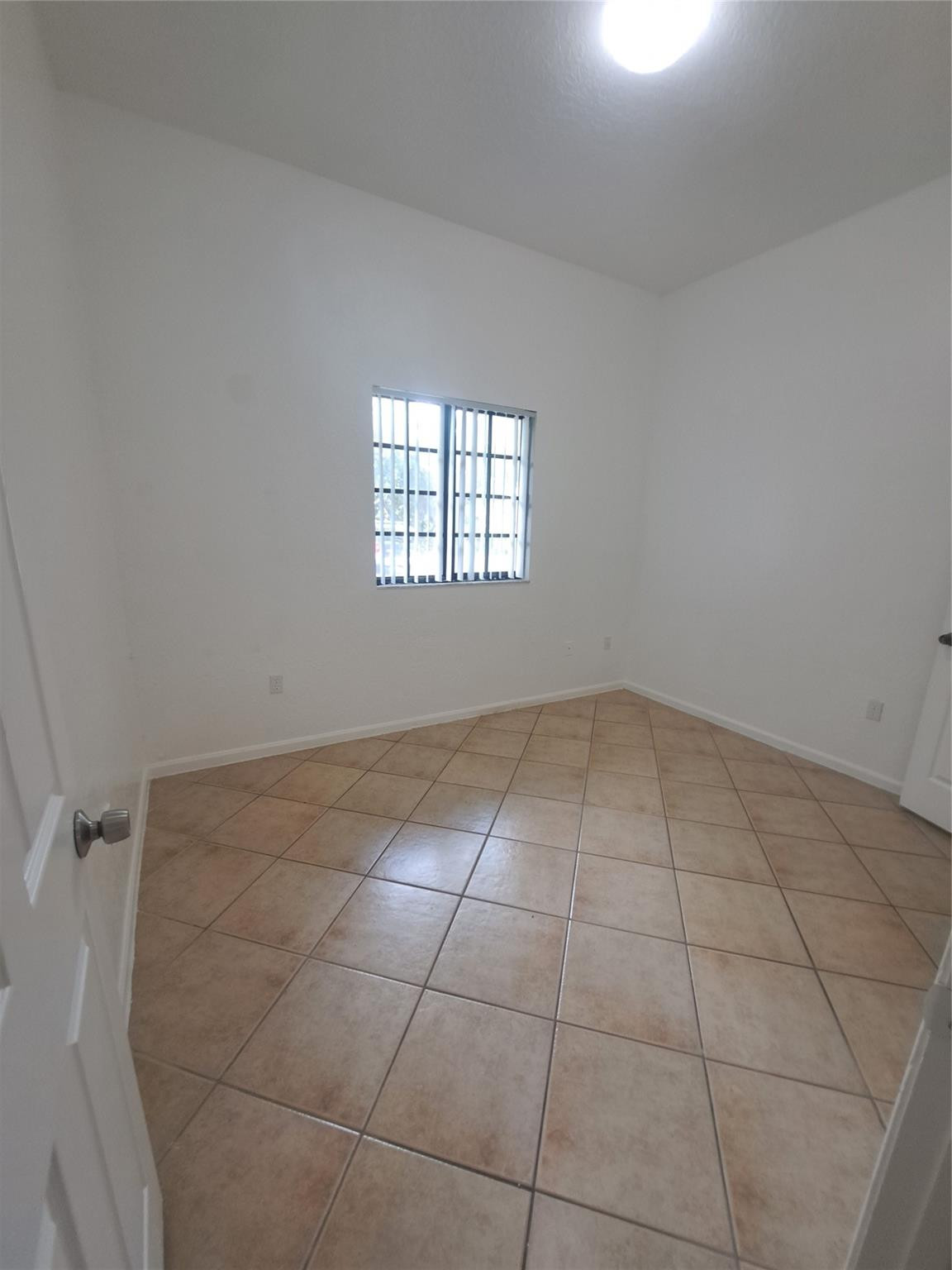 2851 Riverside Drive, Unit 407 Coral Springs, FL 33065 - Photo 5 of 10 a view of a room that has a window in it