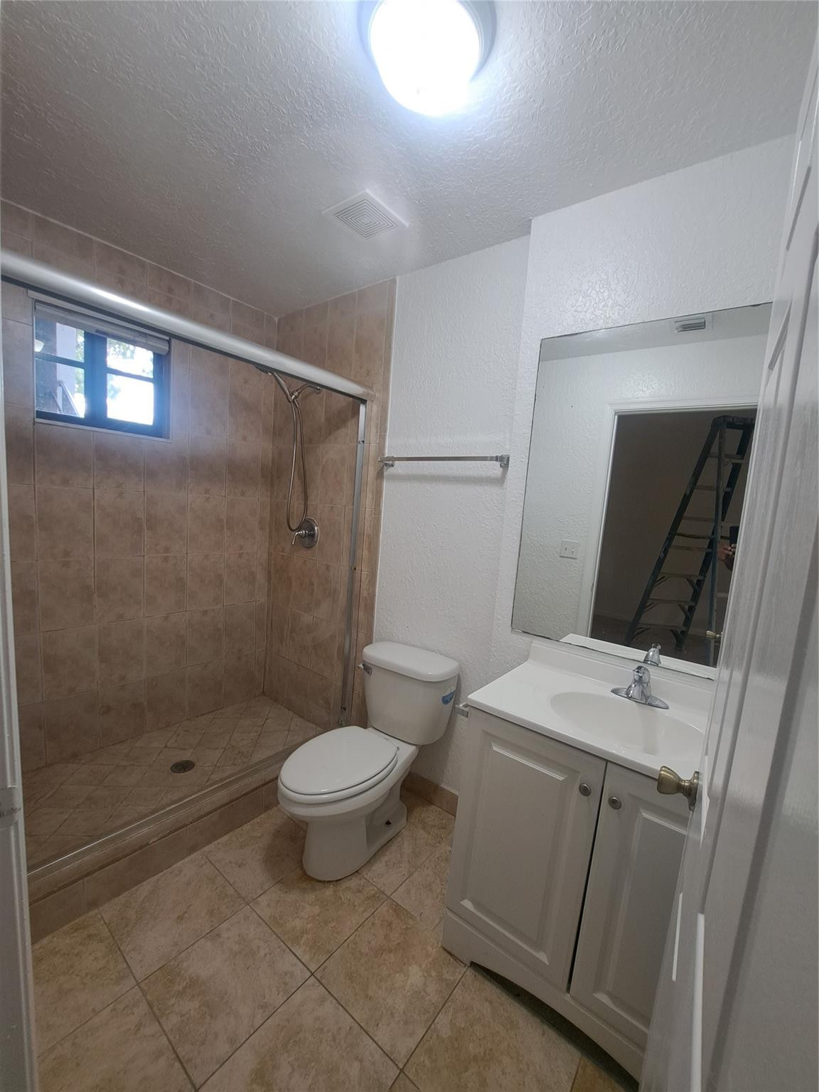 2851 Riverside Drive, Unit 407 Coral Springs, FL 33065 - Photo 9 of 10 a bathroom with a sink toilet and shower
