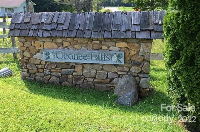 a view of a garden with wooden fence