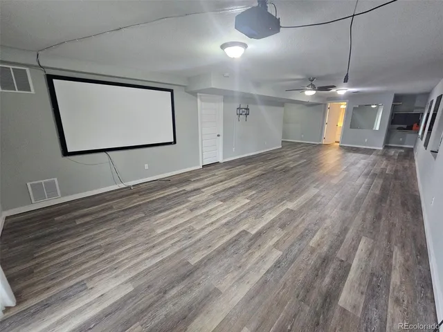 a view of a livingroom with wooden floor